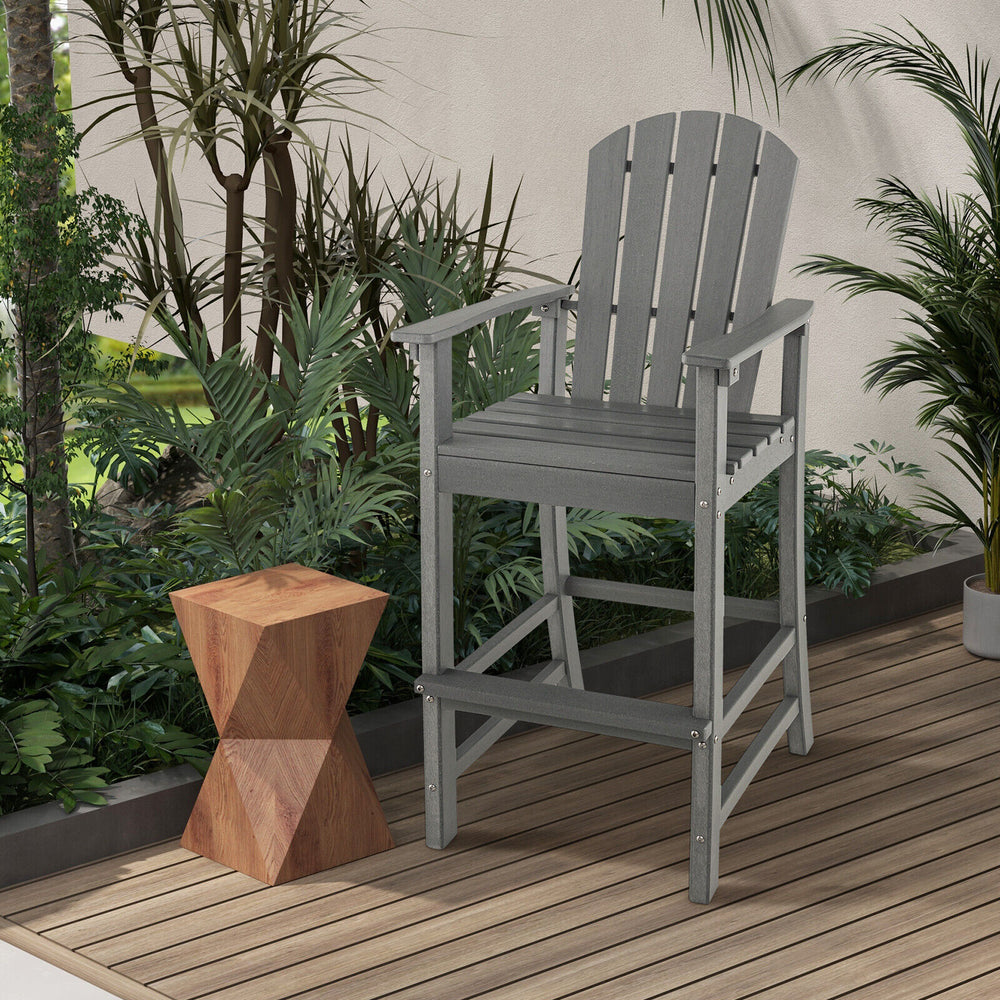 Gray 30-inch counter height outdoor HDPE bar stool with armrests, footrest, and slatted design for comfort and.