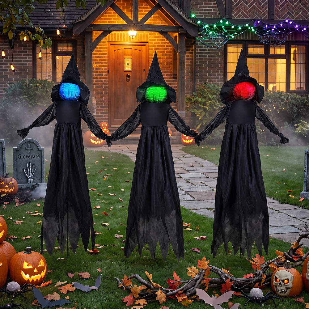 Three outdoor Halloween witch decorations with LED lighted faces, featuring a faceless design and wear-resistant fabric.