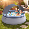 Outdoor inflatable pool with UPF 50+ sunshade canopy, accommodating 4-6 adults for backyard summer fun.