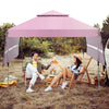 Outdoor instant pop-up canopy tent in pink with dual side awnings, perfect for beach picnics and family gatherings.