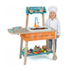 Wooden outdoor kids play kitchen set in orange with removable sink, featuring a child chef and colorful play food.