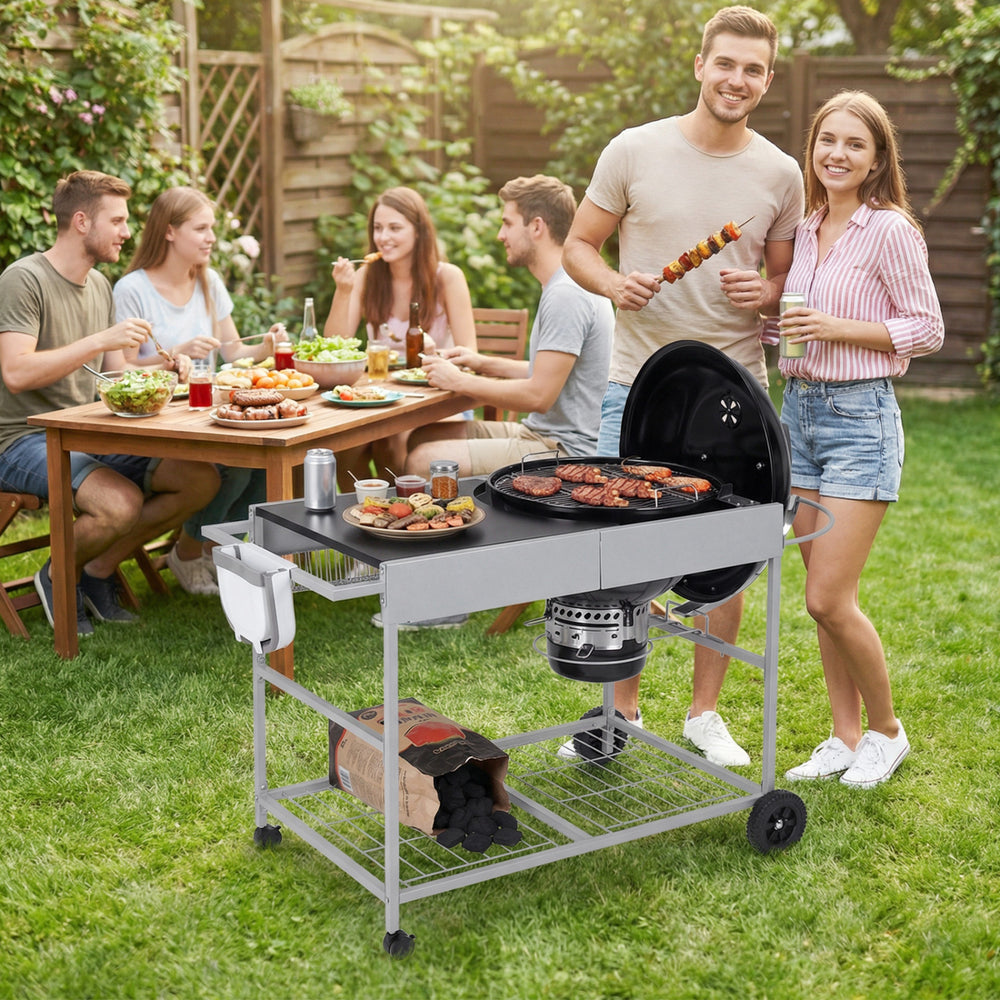 Movable outdoor grill table with spacious tabletop, adjustable clips, and wheels for easy mobility, perfect for camping.