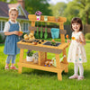 Children engaging in play with the yellow outdoor mud kitchen, featuring a grill, sink, and gardening tools for.