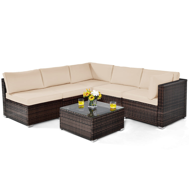 Modular outdoor seating set with beige cushions, all-weather PE rattan, and a glass-top coffee table for entertaining.