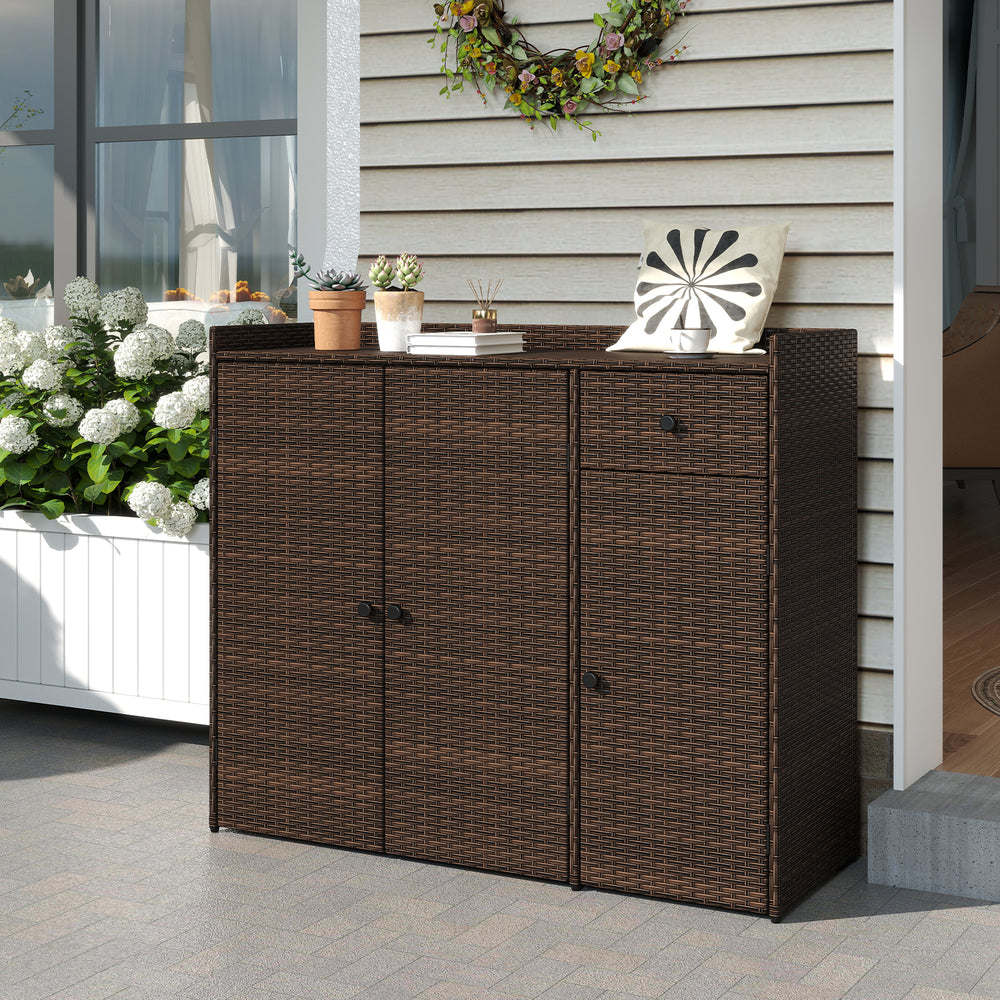 Outdoor PE wicker storage cabinet with three doors and a practical drawer, ideal for organizing patio essentials.