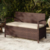 Outdoor PE wicker storage bench with beige cushion, featuring 42-gallon storage and ergonomic design for patio.