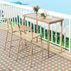 Outdoor patio bar table with a brown woven rattan top and metal frame, ideal for balcony gatherings.