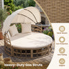 Outdoor patio daybed with retractable canopy, hand-woven yellow wicker rattan, and comfortable cushions for garden relaxation.