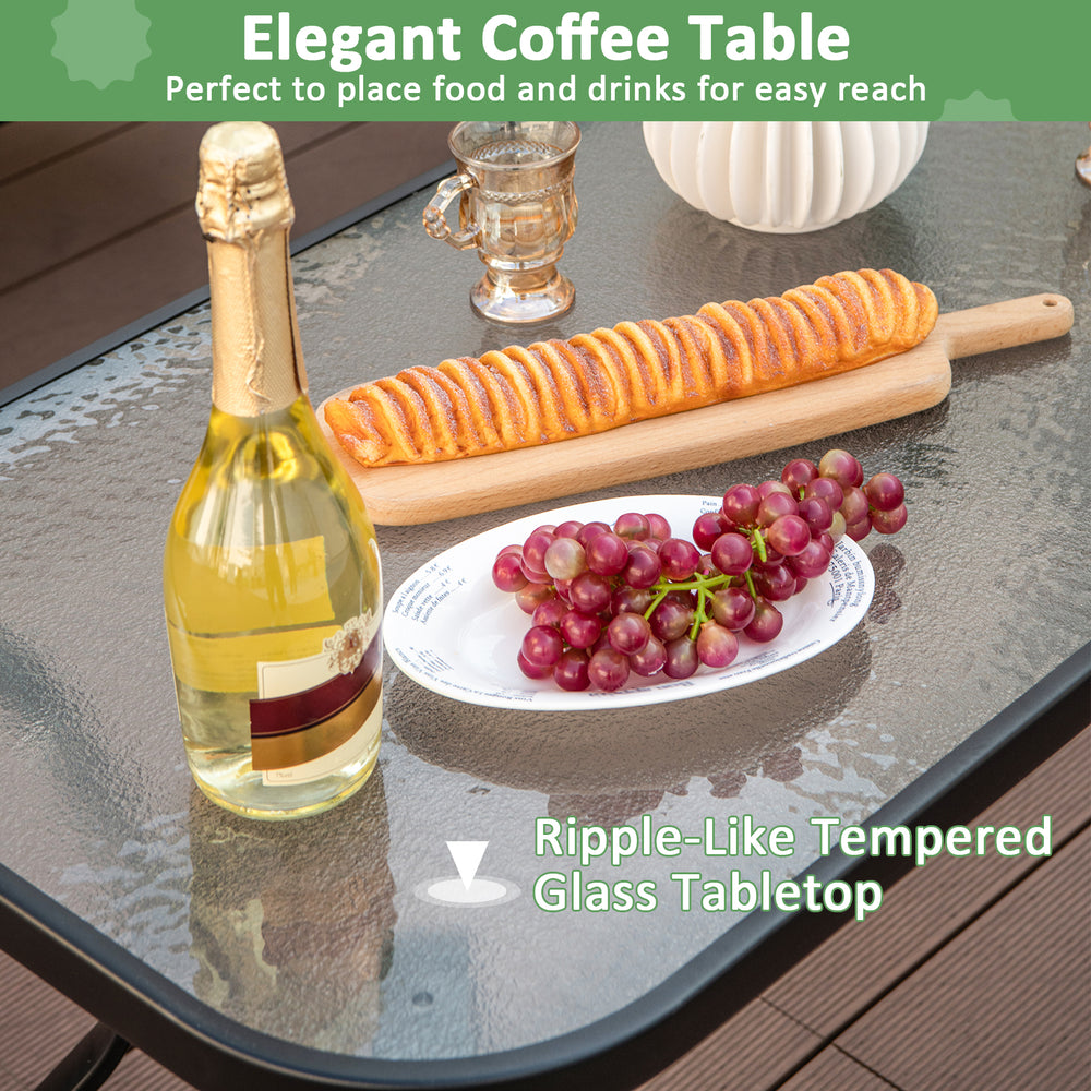 Ripple-like tempered glass coffee table with food and drinks, part of a 4-piece outdoor conversation set in gray.