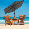 Gray 7.5 feet outdoor patio market umbrella with push button tilt, providing shade for beach relaxation.
