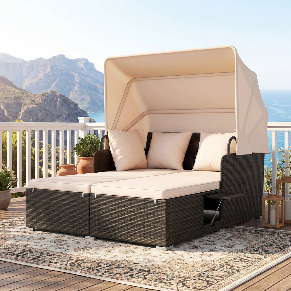 Outdoor patio rattan daybed with retractable canopy and beige cushions, perfect for backyard relaxation.