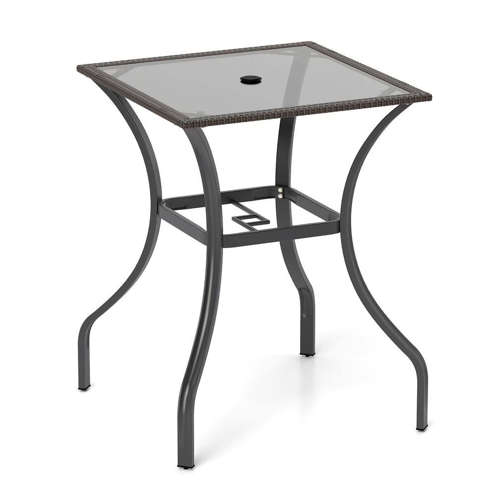 Square outdoor patio table with rattan edging and 5 mm thick glass top, perfect for indoor and outdoor use.