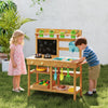 Children's outdoor play pretend kitchen with removable sinks, stovetops, and chalkboard for creative cooking fun.