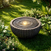 Round sphere water fountain with LED lights, showcasing a textured stone finish and peaceful water flow for outdoor.