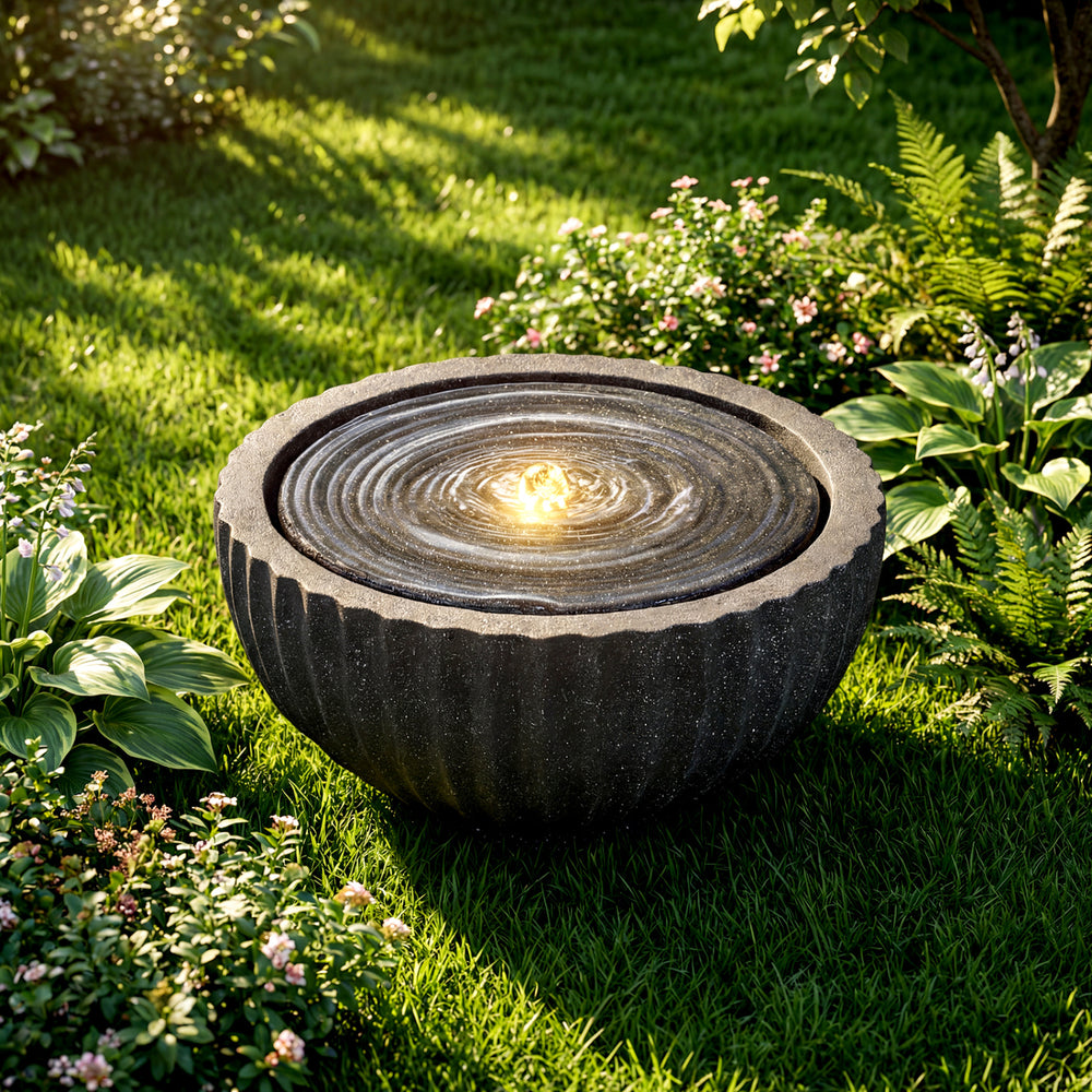 Round sphere water fountain with LED lights, showcasing a textured stone finish and peaceful water flow for outdoor.