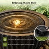 Round sphere water fountain with LED lights, featuring a realistic stone look and adjustable flow for tranquil outdoor.