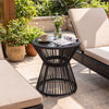 Outdoor side table with a black PE rattan design, tempered glass top, and LED warm light, perfect for patio use.