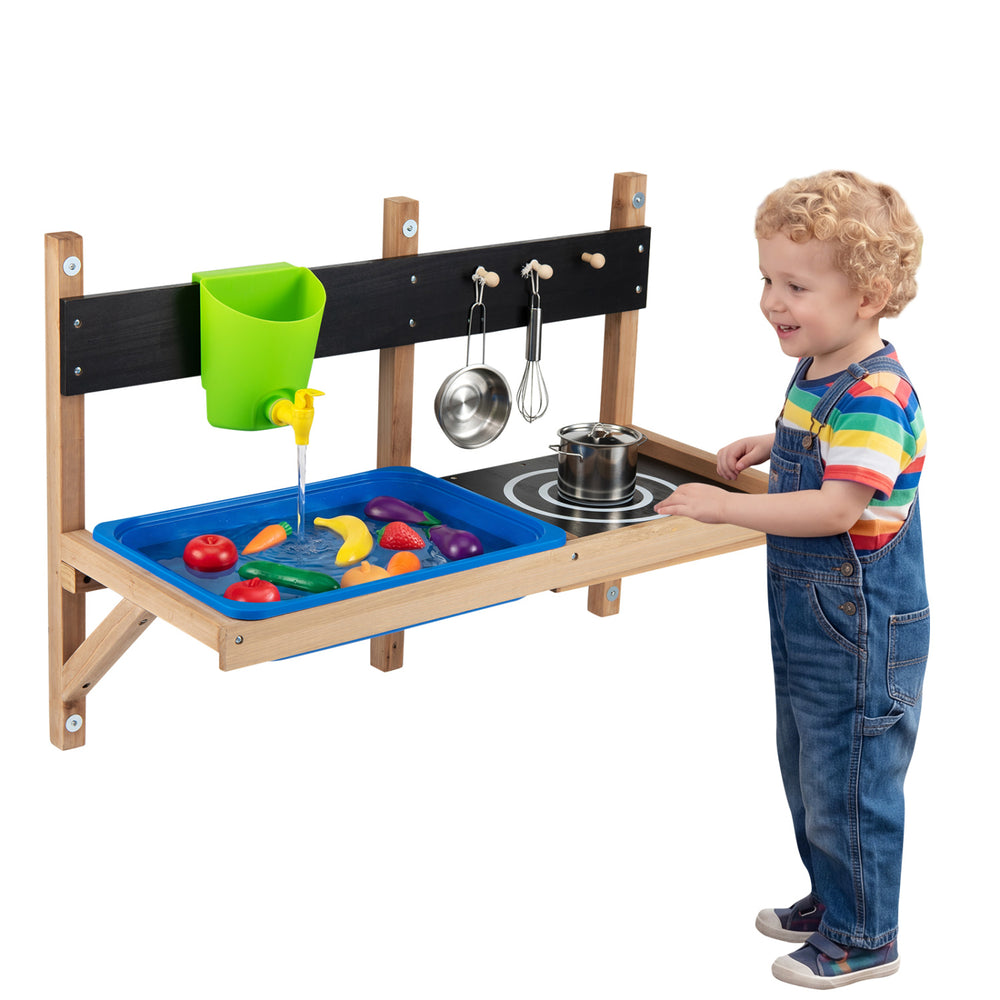 Outdoor wall-mounted mud kitchen for kids featuring a sink, stovetop, and water faucet for imaginative play.