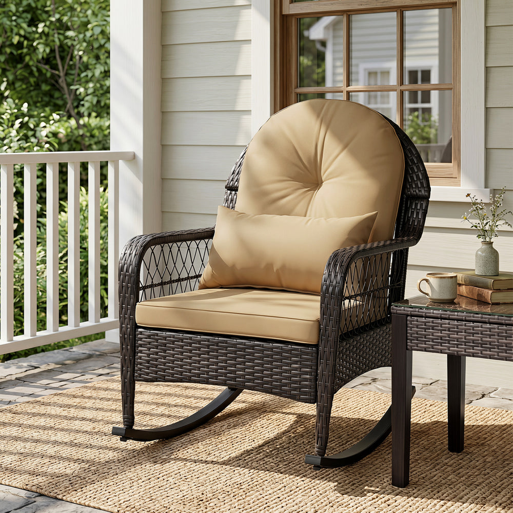 Outdoor wicker rocking chair in brown with thick cushions, designed for comfort and stability on porches and patios.