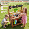 Outdoor wood mud kitchen for kids features a sink, planter, and storage, promoting gardening and creative play.