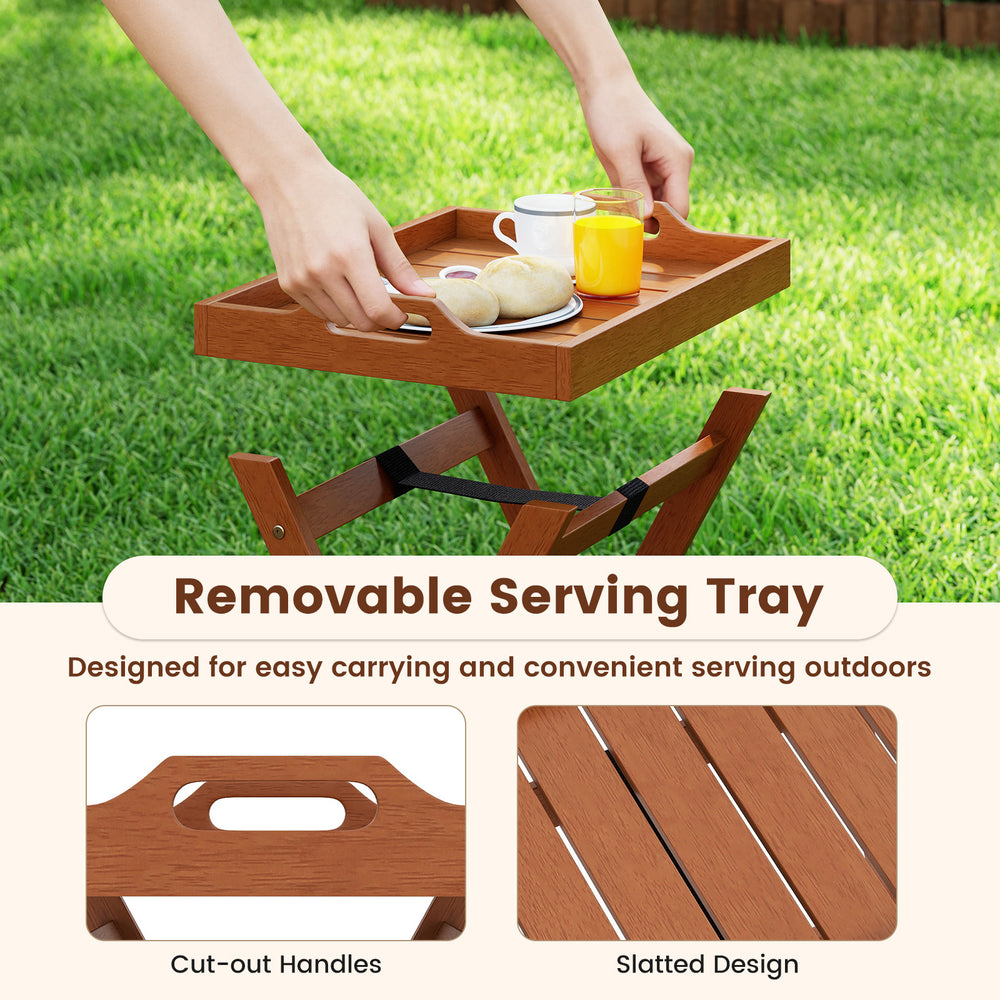 Removable wooden serving tray with cut-out handles on a folding side table, perfect for outdoor use and easy storage.