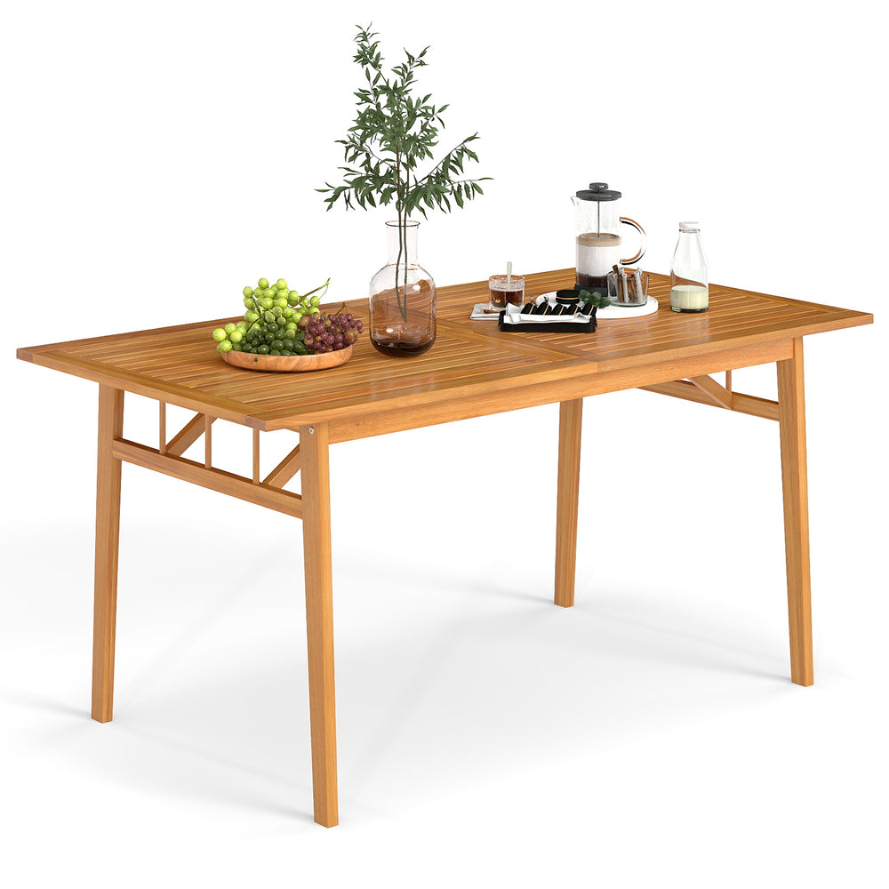 Outdoor wooden dining table made of acacia wood, featuring a slatted top and umbrella hole, perfect for 4-6 guests.