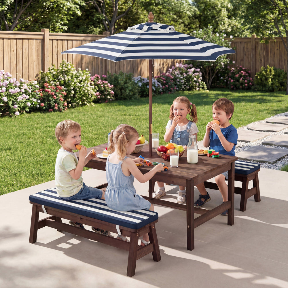 Kids enjoying snacks at the Outdoor Wooden Picnic Table with removable umbrella and blue cushions in a garden setting.