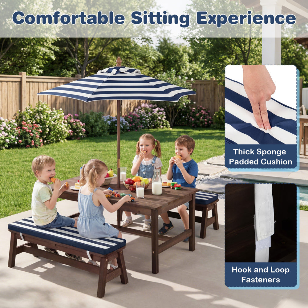 Kids enjoying snacks at the outdoor wooden picnic table with removable umbrella and blue cushions for comfort.