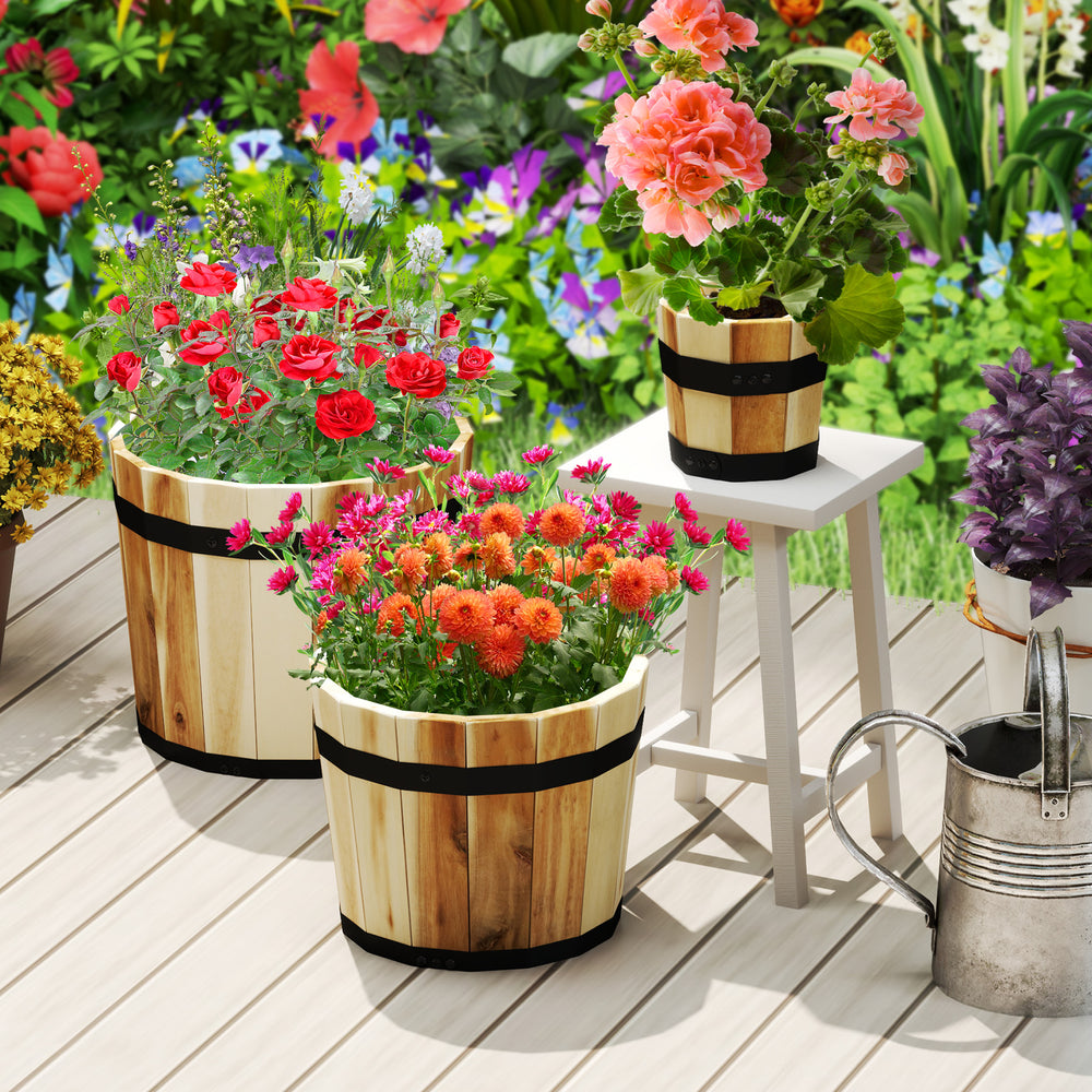 Set of 3 outdoor wooden planters in half whiskey barrel shape, crafted from acacia wood, perfect for garden decoration.