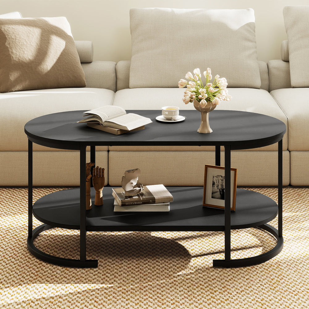 Oval coffee table with black finish, 2-tier design, spacious storage, and elegant wood grain texture for versatile use.