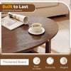 Oval coffee table with thickened walnut top, featuring a smooth surface and ample space for snacks and decor.