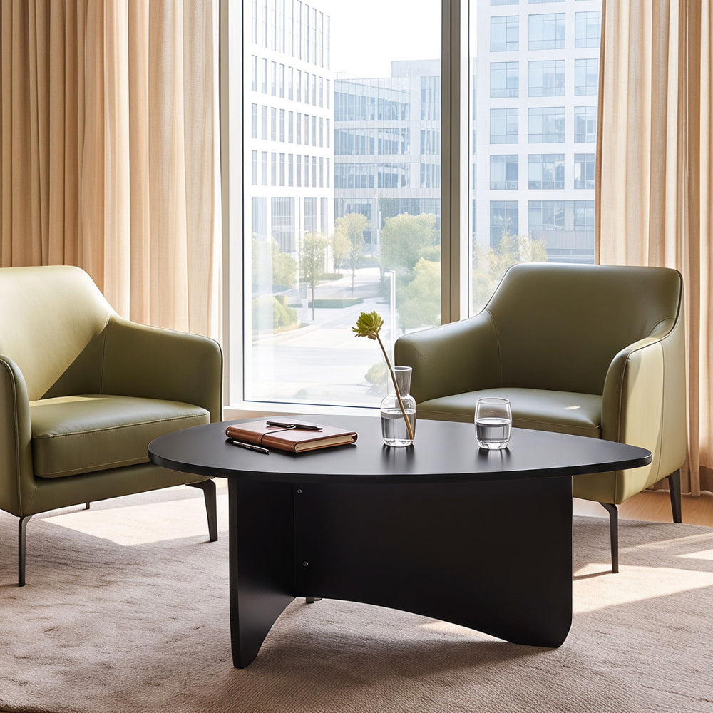 Oval black coffee table with a spacious surface and rounded corners, perfect for casual lounging and easy cleaning.