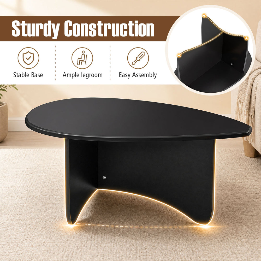 Spacious black oval coffee table with a stable T-shaped base, perfect for lounging and easy assembly.