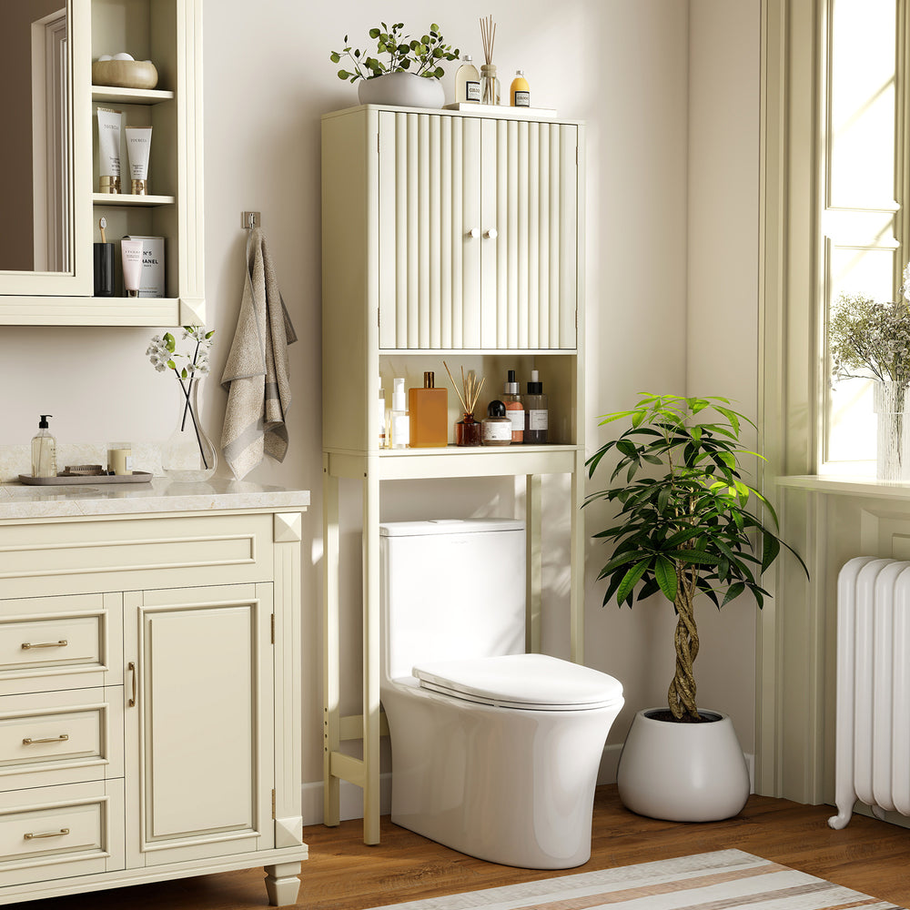 Over the toilet storage cabinet in beige with fluted doors, featuring adjustable shelves for bathroom organization.