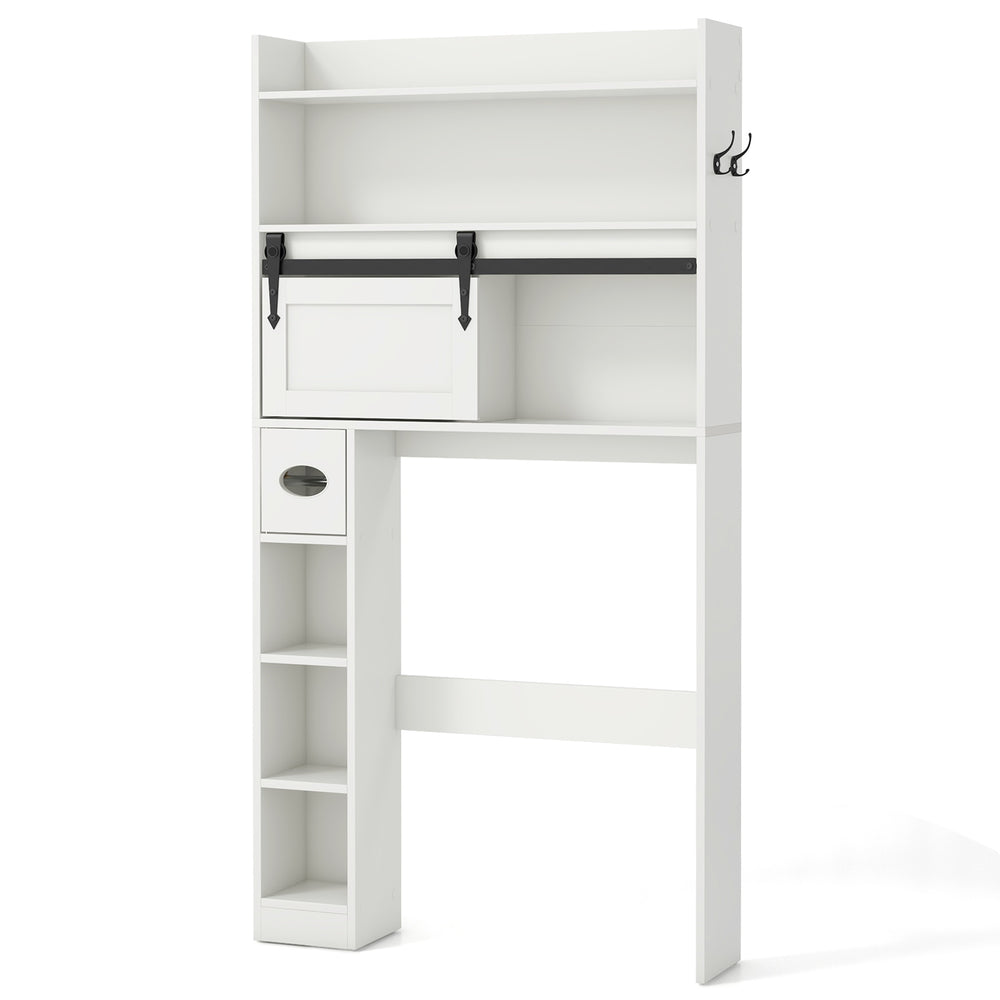 Over the toilet storage cabinet in white with sliding barn door, adjustable shelves, and hooks for bathroom.
