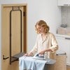 Over the door ironing board in gray with a metal frame, featuring a heat-resistant cover for convenient laundry use.