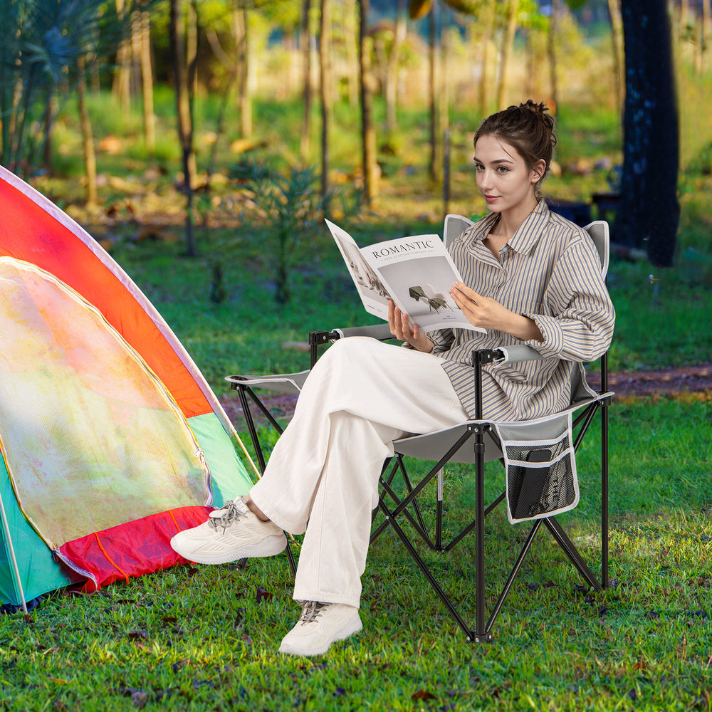 Oversized gray camping chair with side table, cup holder, and storage pockets, perfect for outdoor relaxation.