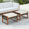 Set of 2 PE rattan wicker ottomans with removable beige cushions, ideal for outdoor patios and versatile seating.