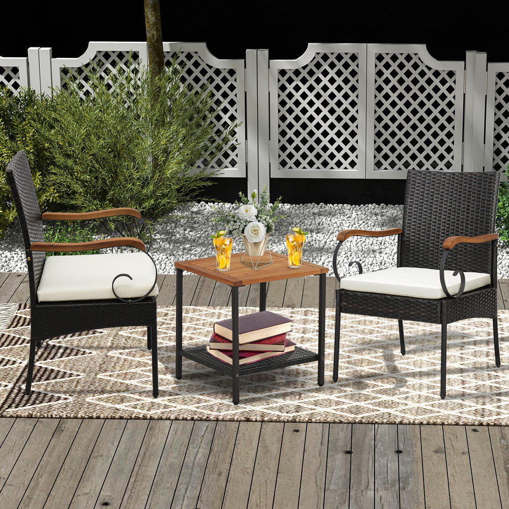 Set of 2 outdoor PE wicker chairs with acacia wood armrests, featuring cushions, on a patio for relaxation.