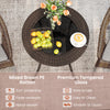 Round PE wicker patio bistro table with tempered glass top, featuring hand-woven brown rattan for outdoor use.