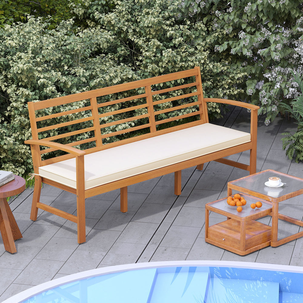 Patio 64-inch wood bench with off-white seat cushion, slatted design, ideal for backyard and garden seating.