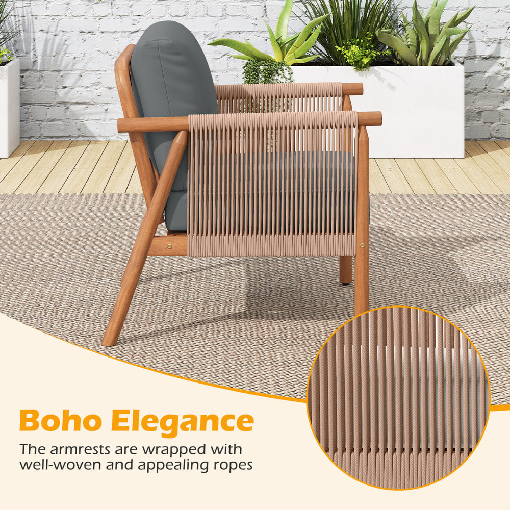 Side view of a patio acacia wood chair with woven rope armrests and gray cushions, perfect for backyard relaxation.