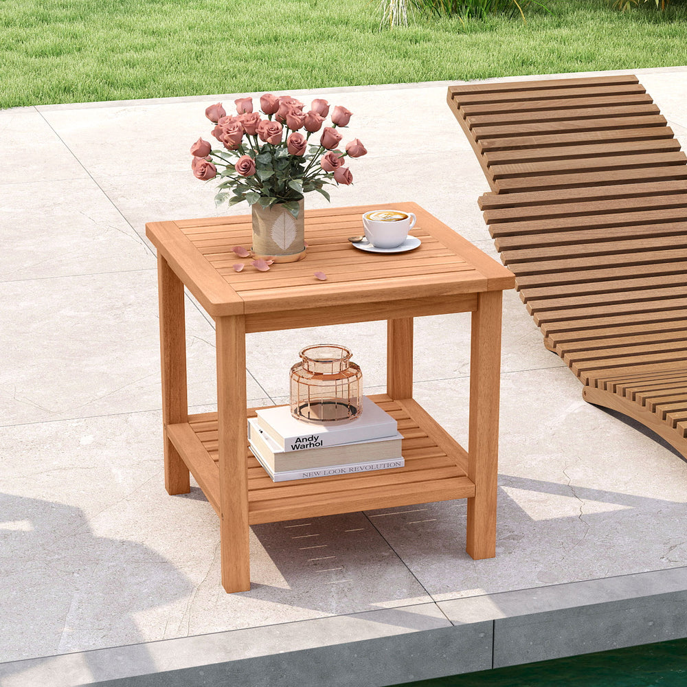 Acacia wood side table with slatted tabletop and storage shelf, perfect for patio or poolside use.