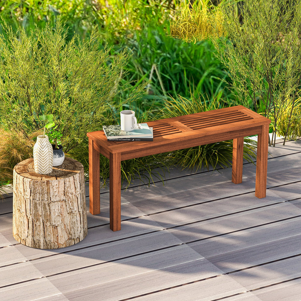 Backless 2-seater patio dining bench made of solid wood with a slatted seat, ideal for outdoor garden use.