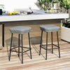 Set of 2 29.5-inch patio bar stools with rattan seats and sturdy metal frames, ideal for outdoor dining areas.