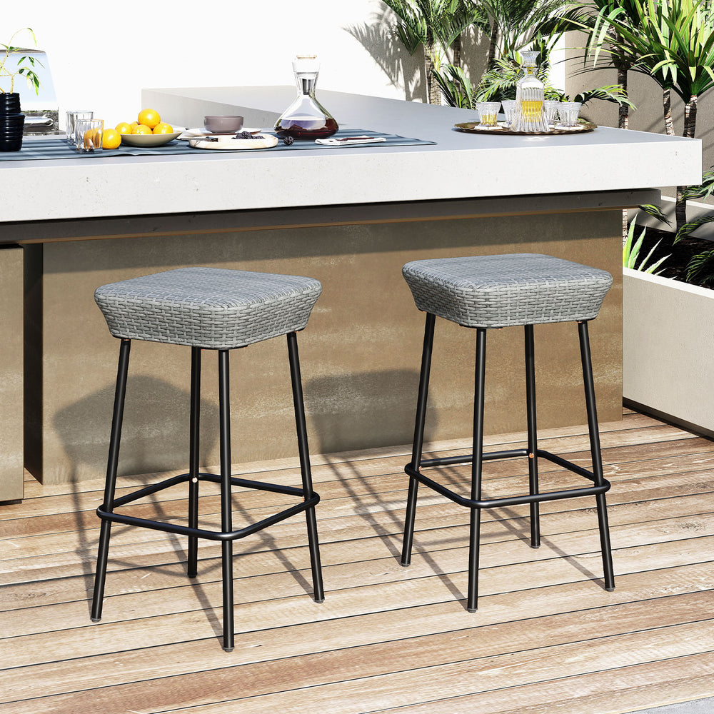 Set of 2 29.5-inch patio bar stools with rattan seats and sturdy metal frames, ideal for outdoor dining areas.