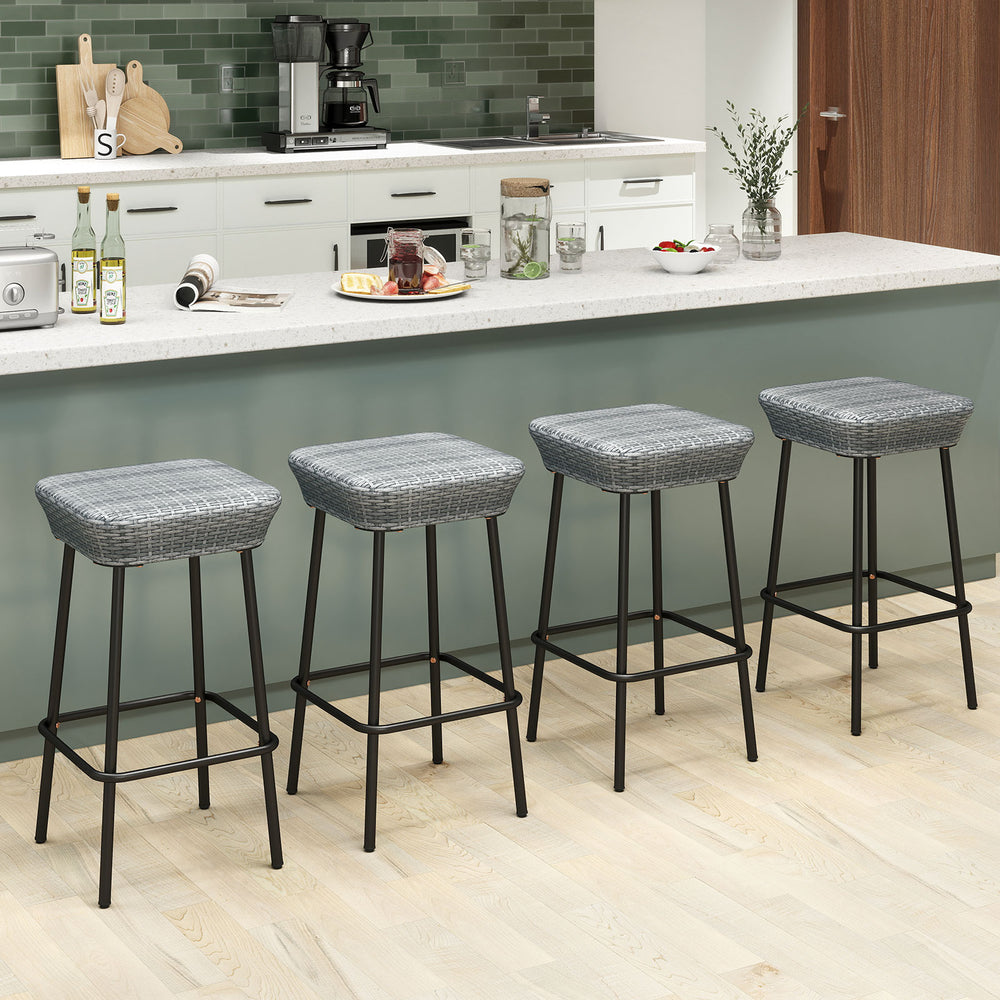 Set of four 29.5-inch patio bar stools with rattan seats and sturdy metal frames, perfect for kitchen or outdoor use.