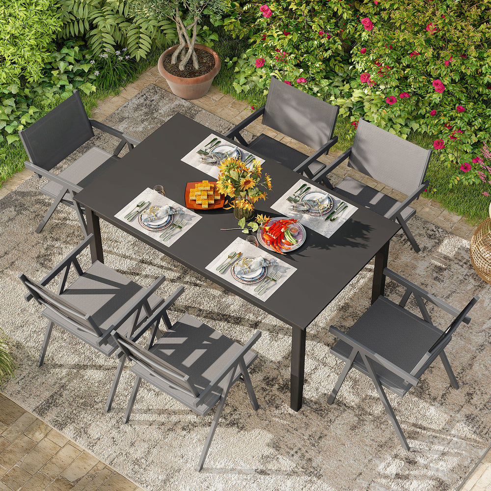 Outdoor dining setup featuring a set of two patio chairs with breathable fabric seats, ideal for comfort and support.