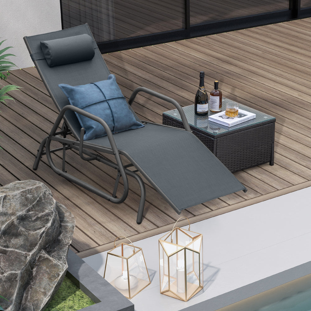 Gray outdoor chaise lounge glider chair with adjustable backrest and pillow, perfect for relaxing by the pool.
