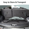 Folding light green patio chaise lounge in a car trunk, designed for easy transport and space-saving storage.